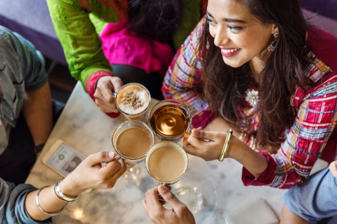 Create a visual representation of tea crossing cultural boundaries, with images of diverse individuals enjoying tea together.